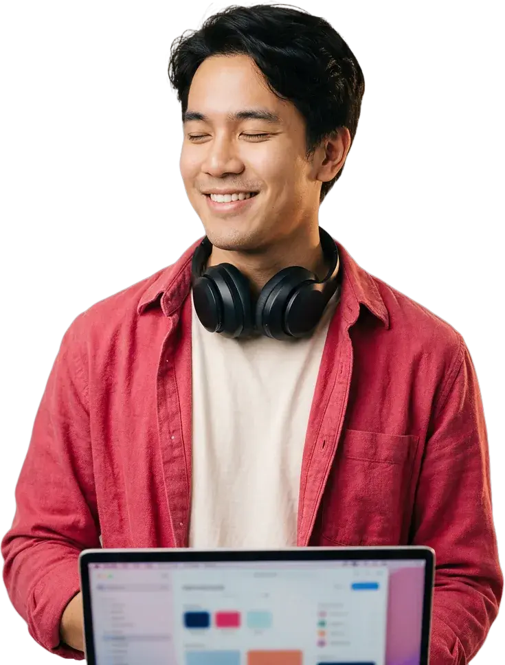 นักพัฒนาของ Vectorkub ยิ้มแย้ม พร้อมหูฟังและแล็ปท็อป